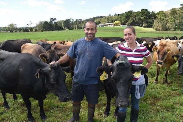Genaro and Rosselyn on-farm with their gentle natured cows.