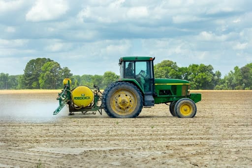 Farm biosecurity measures with cleaning vehicles, machinery and tractors.