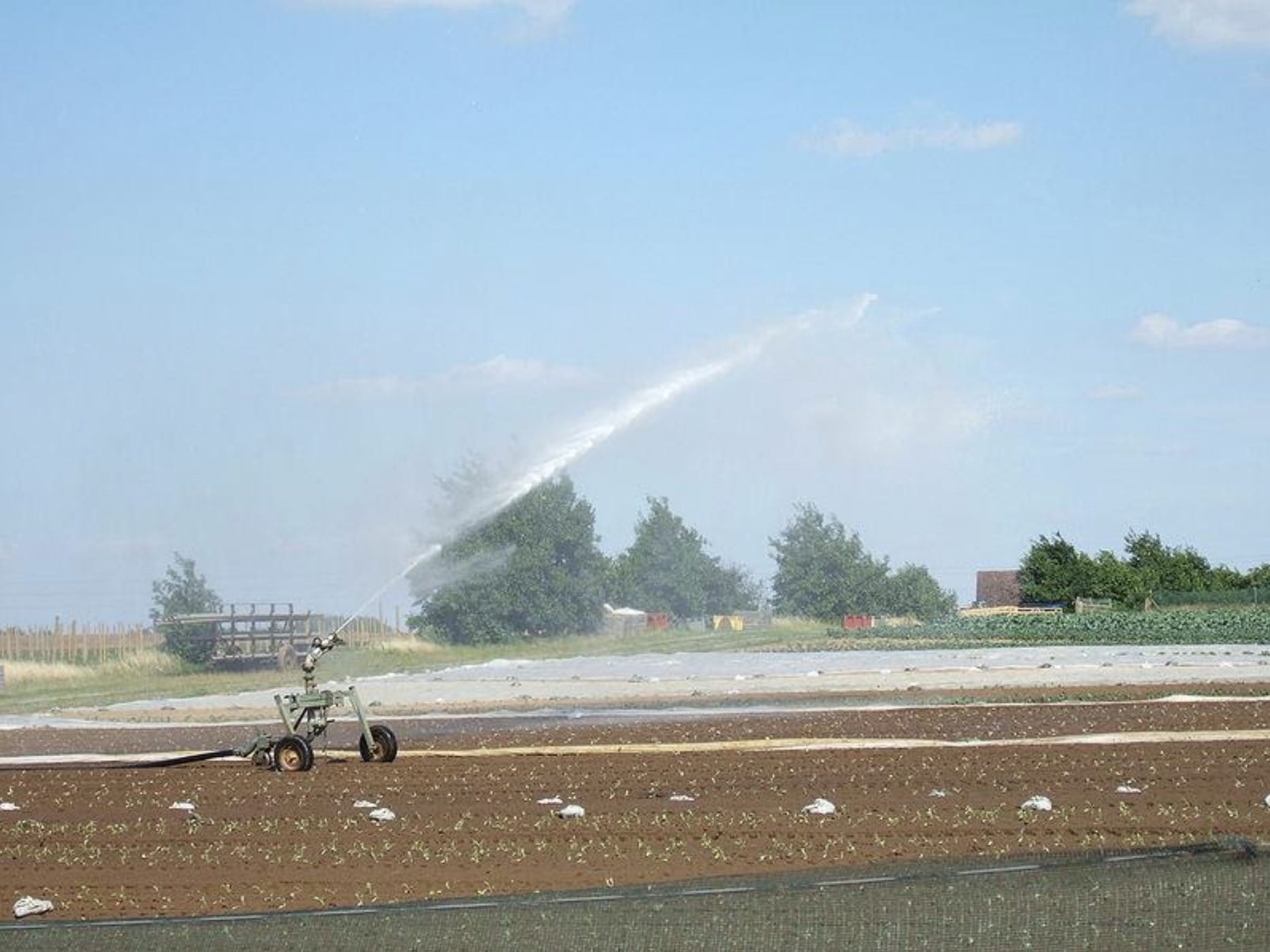 A travelling sprinkler as shown in the above photo can irrigate and reuse effluent on your farm