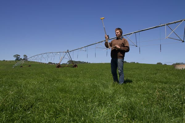 Ollie Roberts using a rising plate meter on his family dairy farm.