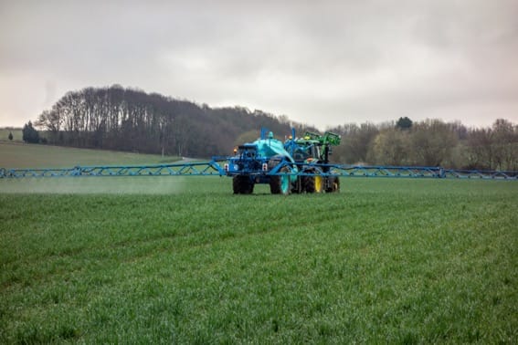 Fertilising ryegrass pasture to boost yield per hectare.