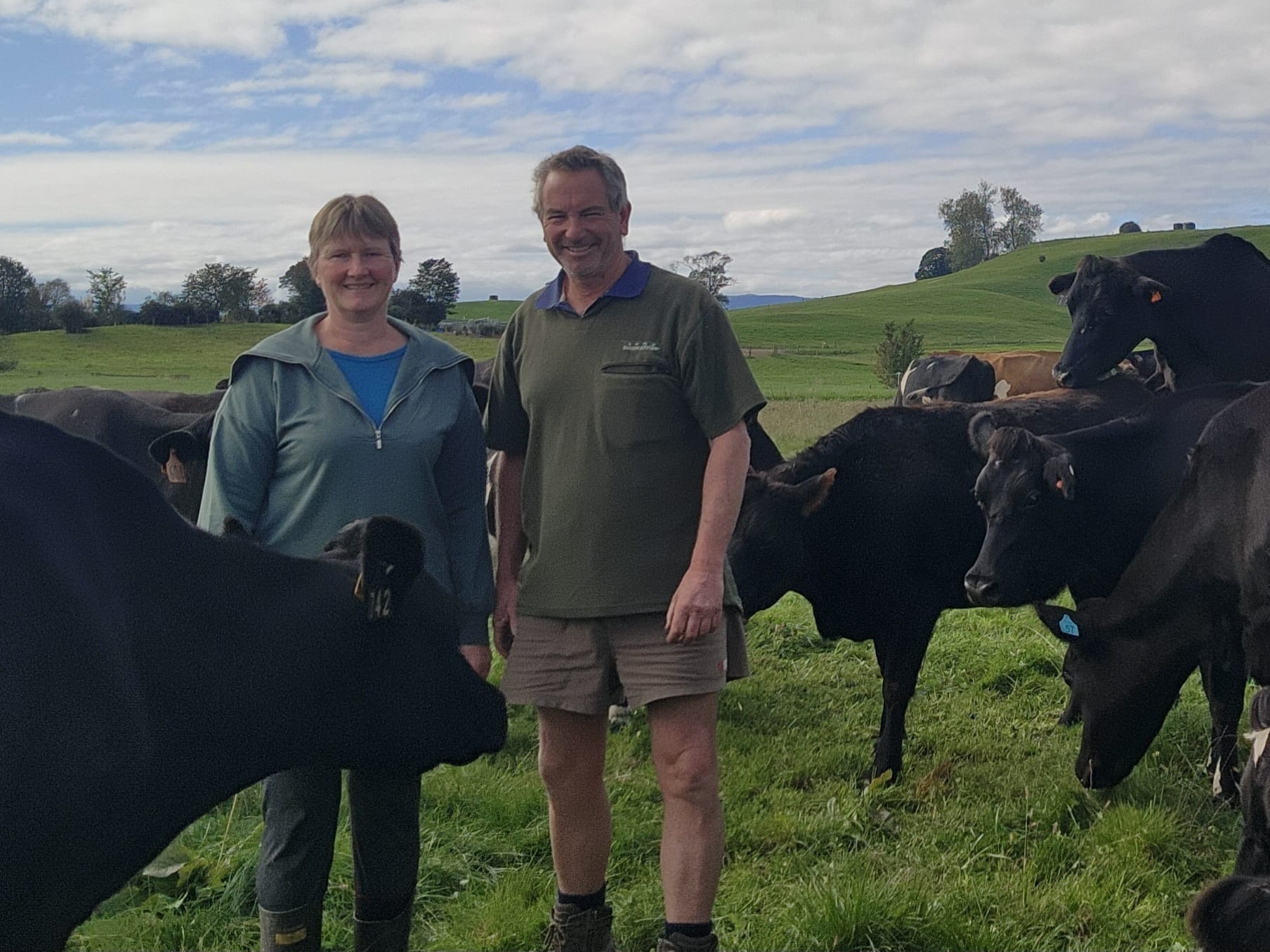 Amanda and Dean Benson with their dairy herd in Okoroire, New Zealand